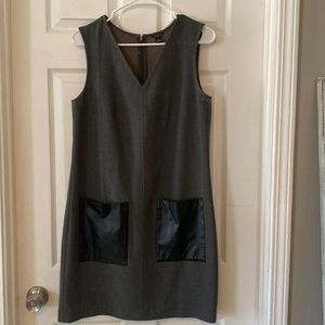 Ann Taylor sleeveless dress. Gray with black faux leather pockets. V-neck.